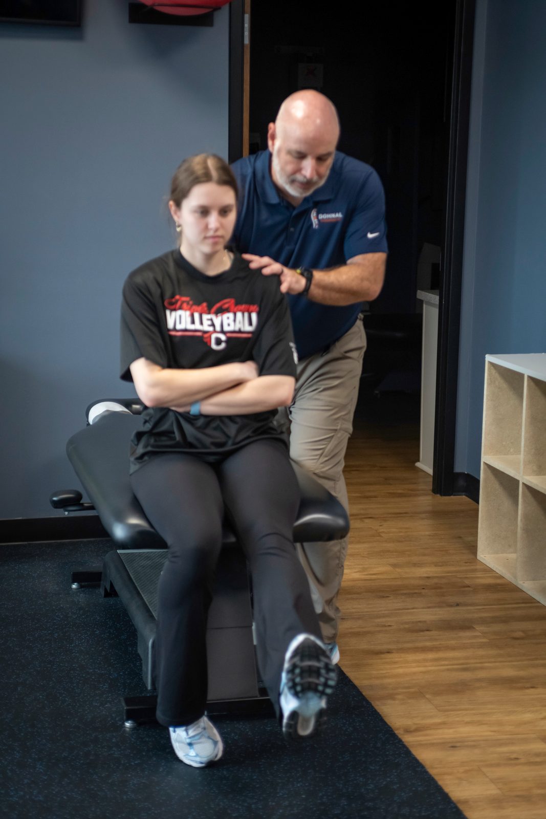 Sports Chiropractic Nashville: Care Built for Athletes 2 Practitioner examining patient's shoulder during clinical exam in office setting